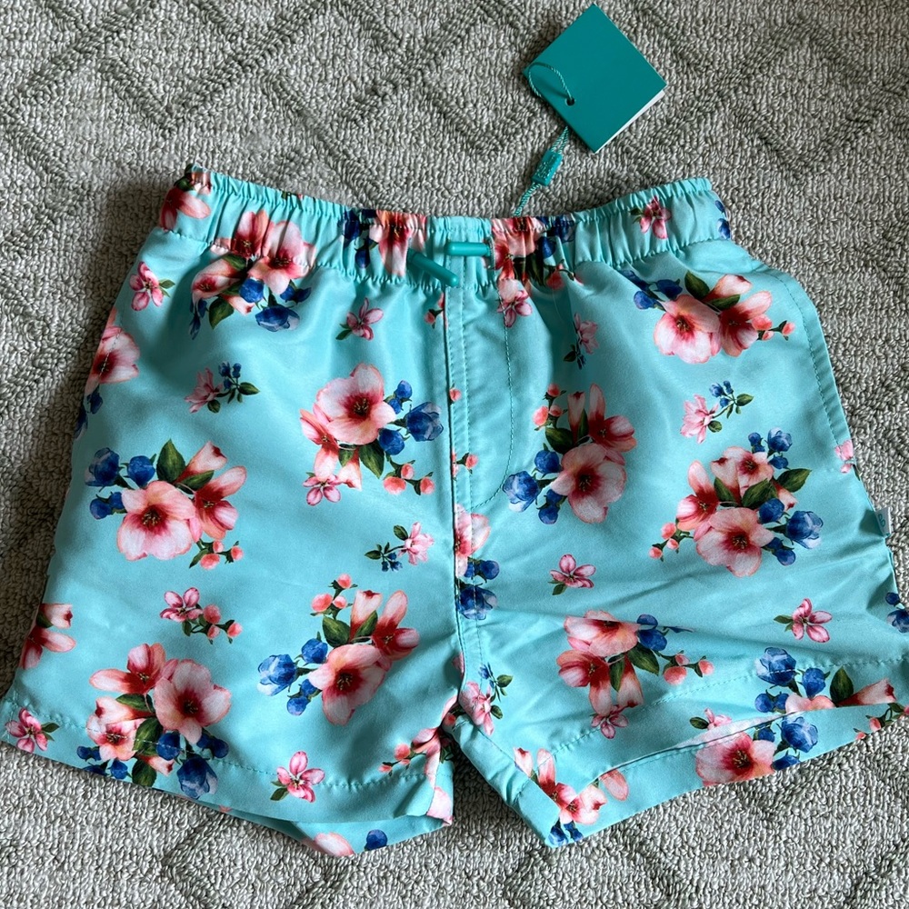 NWT blue/Hawaiian floral shorts by Posh Peanut, size 5T.
